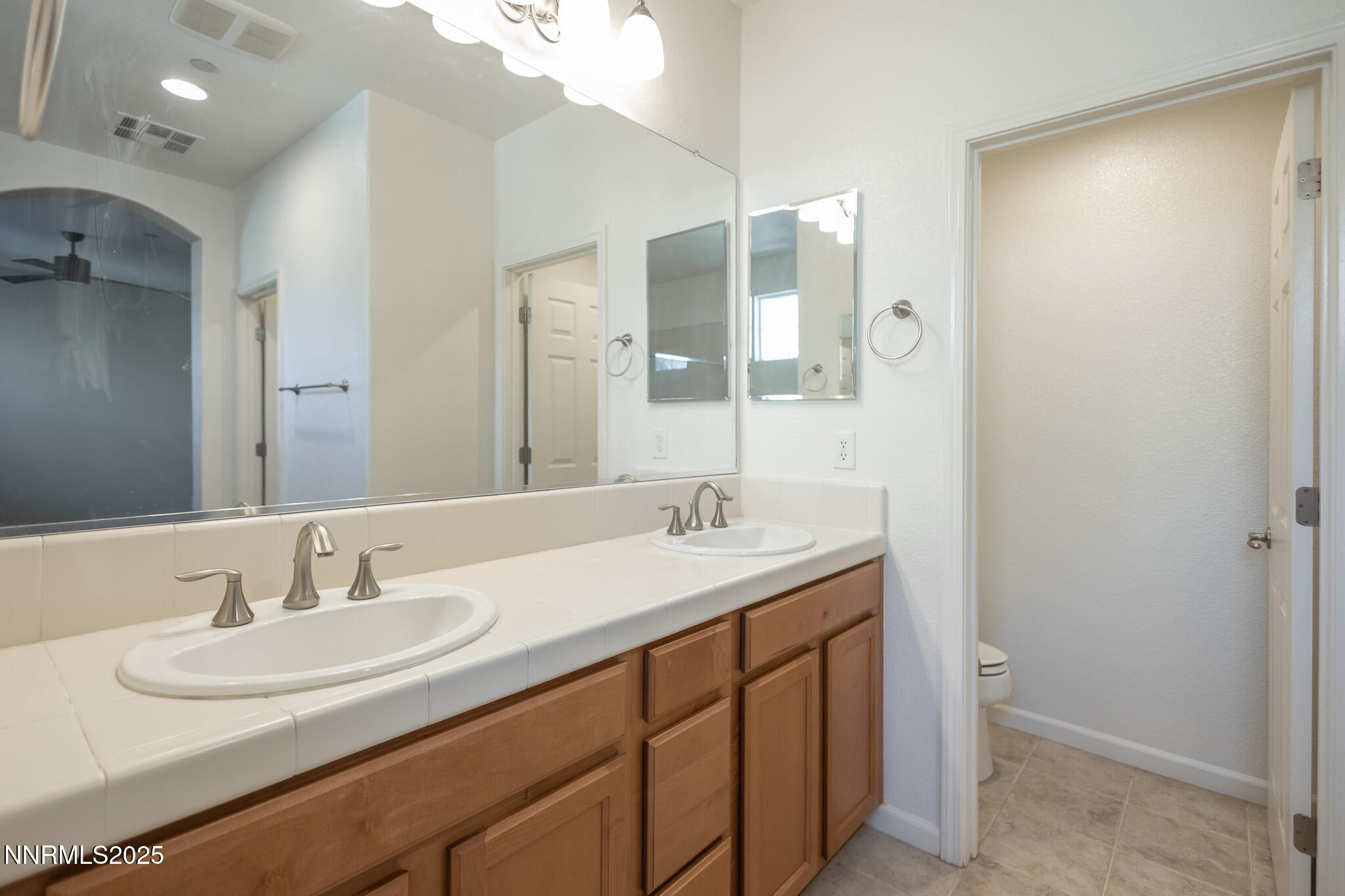 1715 Dark Horse Road, Unit B Reno, NV 89521 - Photo 26 of 39 a bathroom with a sink and a mirror