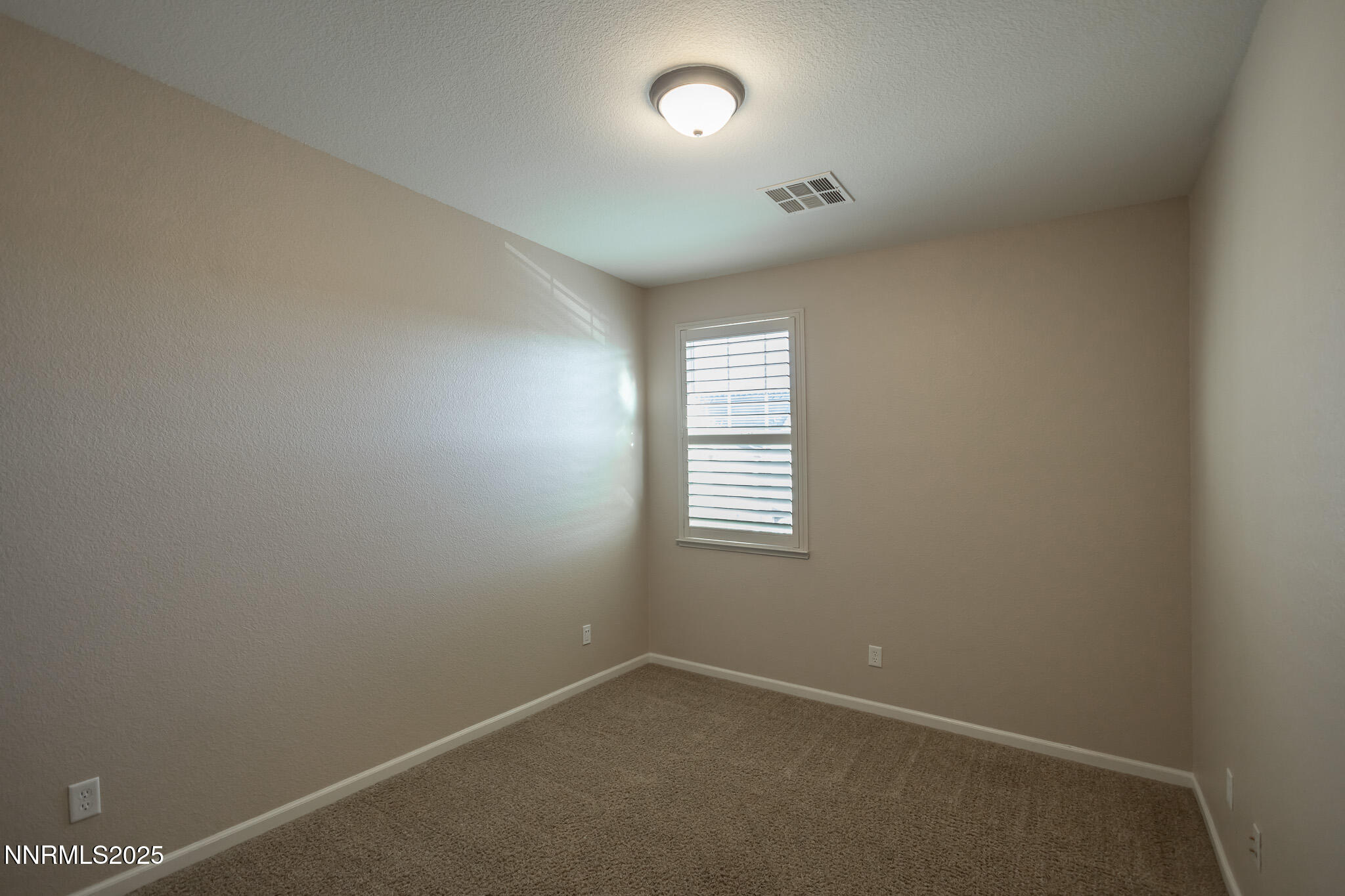 1715 Dark Horse Road, Unit B Reno, NV 89521 - Photo 29 of 39 an empty room with a window