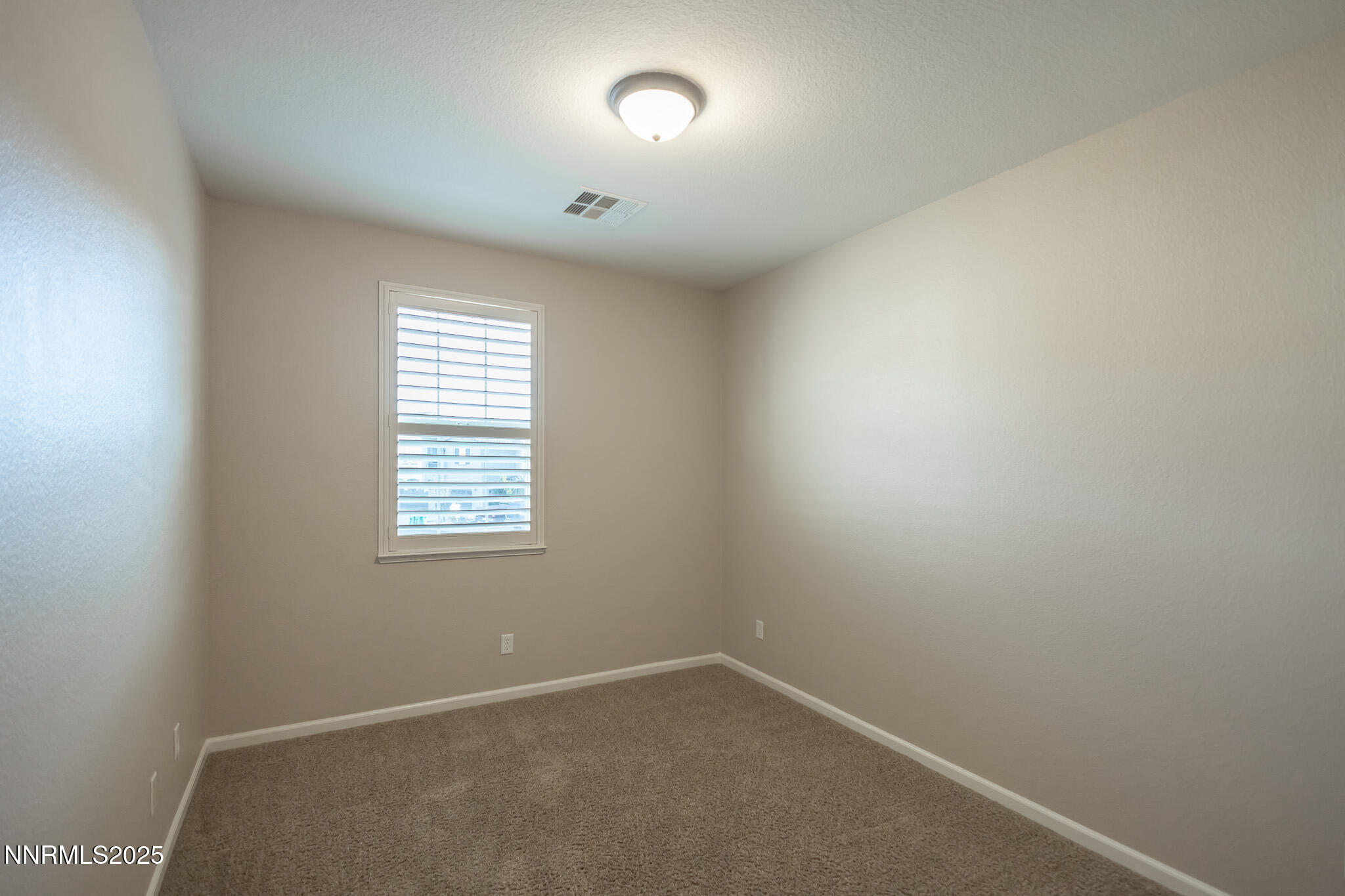 1715 Dark Horse Road, Unit B Reno, NV 89521 - Photo 31 of 39 an empty room with a window
