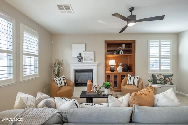 a living room with furniture and a fireplace