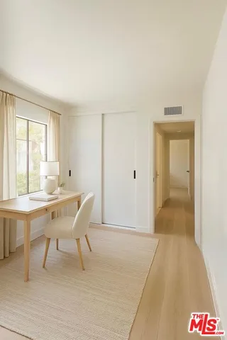 a workspace with furniture and window