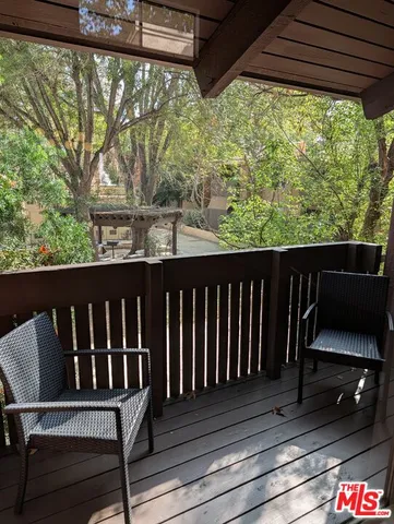 a view of a two chairs in the deck