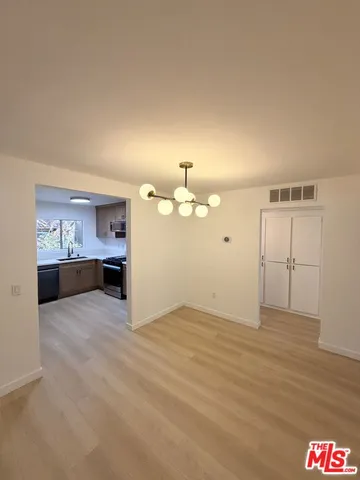 a view of a kitchen with a sink