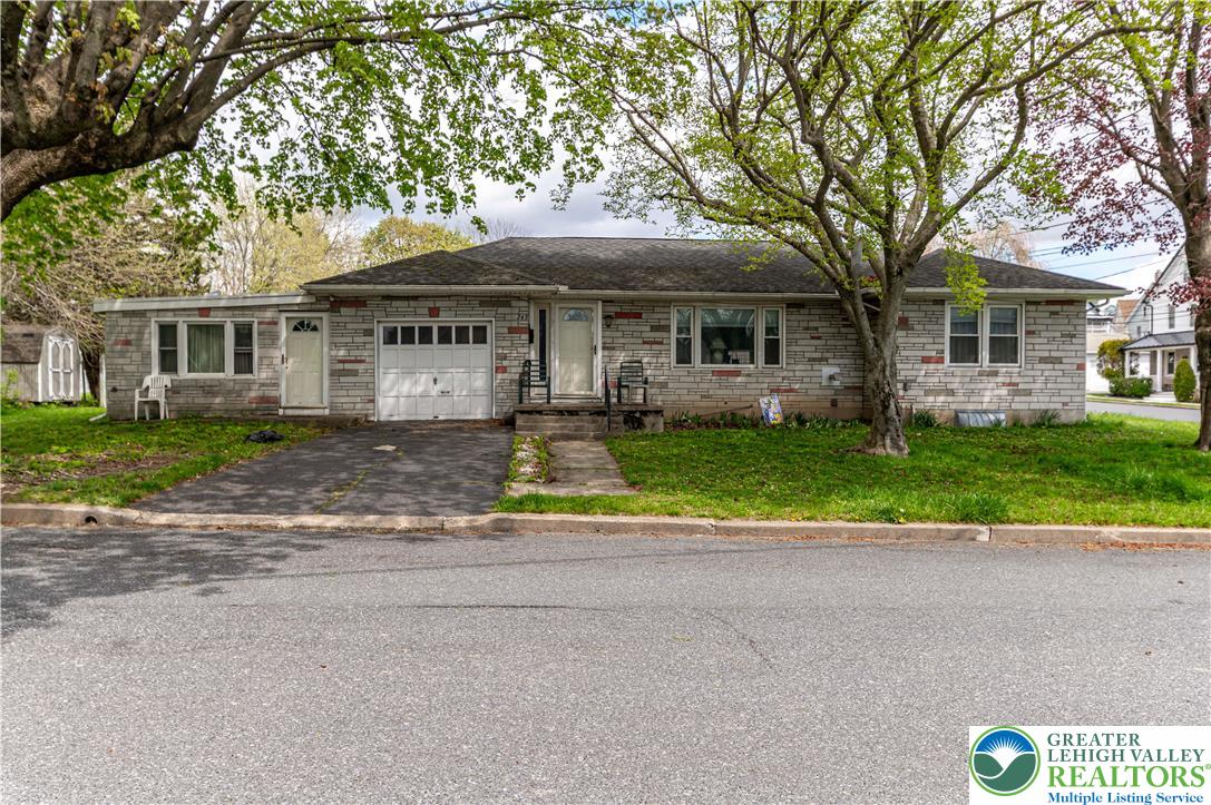 243 East Prospect Street Nazareth, PA 18064 - Photo 1 of 28 a view of a house with a yard and large tree