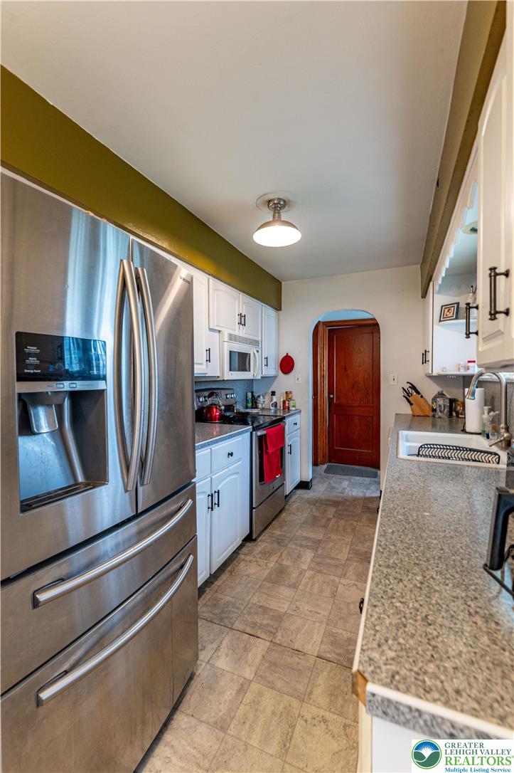 243 East Prospect Street Nazareth, PA 18064 - Photo 11 of 28 a kitchen with stainless steel appliances granite countertop a refrigerator and a stove