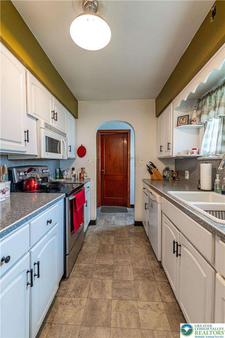 243 East Prospect Street Nazareth, PA 18064 - Photo 12 of 28 a kitchen with stainless steel appliances granite countertop a sink and cabinets