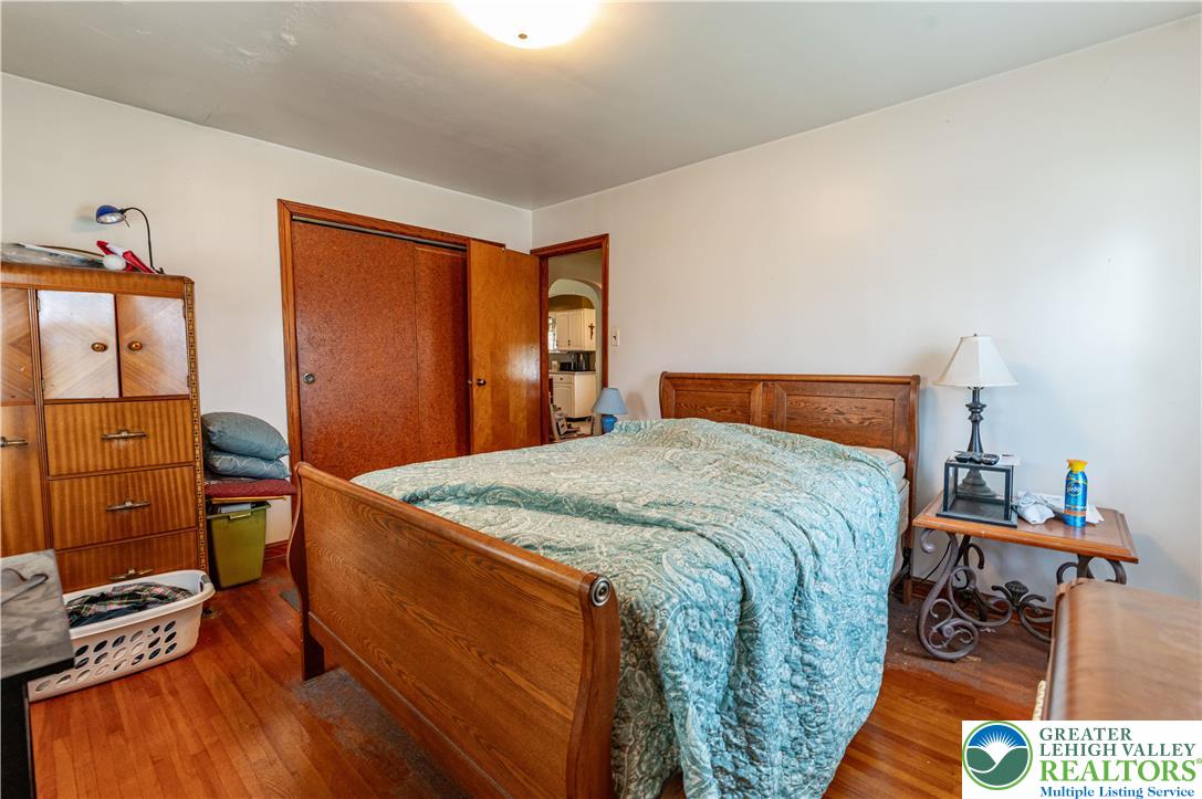 243 East Prospect Street Nazareth, PA 18064 - Photo 19 of 28 a bedroom with a bed and wooden floor
