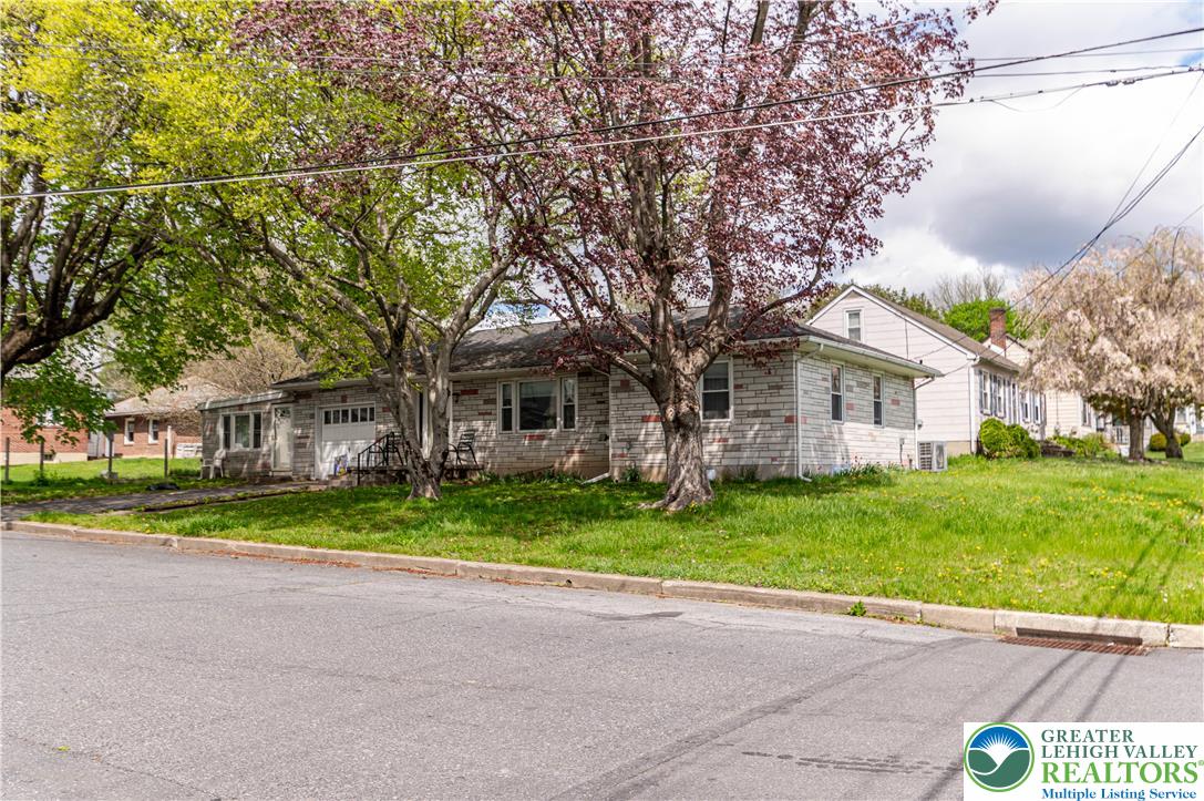 243 East Prospect Street Nazareth, PA 18064 - Photo 2 of 28 a view of a house with a yard and large trees