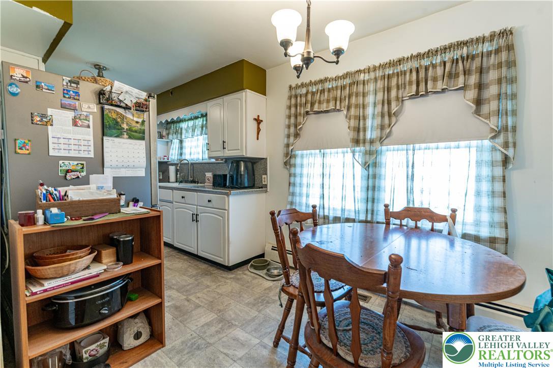 243 East Prospect Street Nazareth, PA 18064 - Photo 7 of 28 a dining room with furniture a chandelier and window