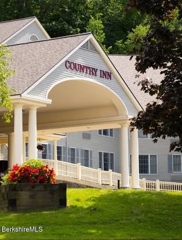 a view of a house with a swimming pool