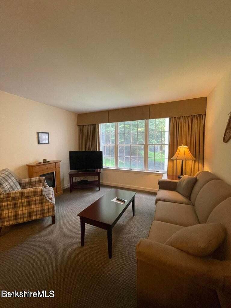37 Corey Road, Unit 623 Hancock, MA 01237 - Photo 4 of 14 a living room with furniture and a large window