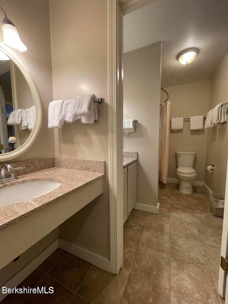 37 Corey Road, Unit 623 Hancock, MA 01237 - Photo 10 of 14 a bathroom with a sink and a toilet