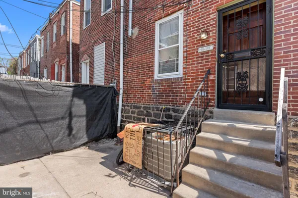 a view of a brick buildings with entryway doors