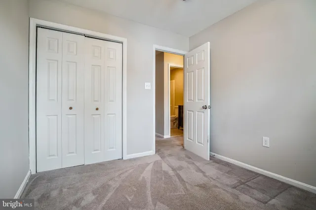 a view of a bathroom with closet and bathroom