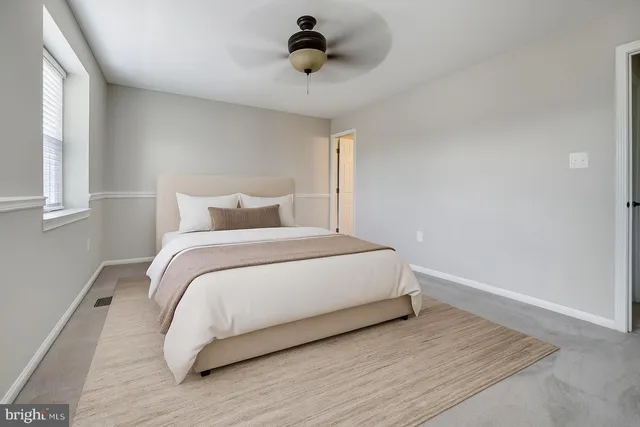 a bedroom with a bed and window