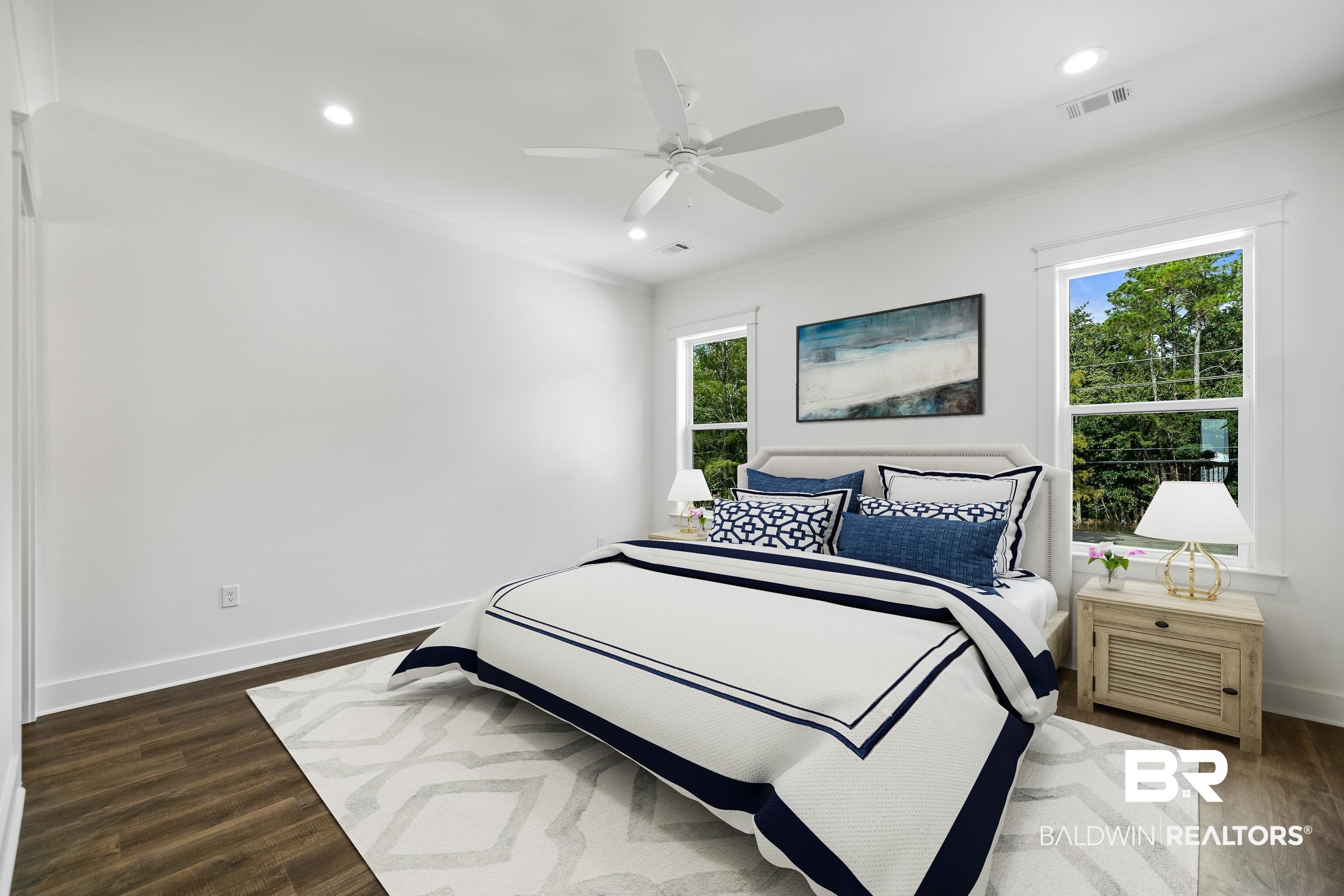 12453 County Road 1 Fairhope, AL 36532 - Photo 22 of 33 Bedroom featuring ceiling fan, dark hardwood / wood-style flooring, and ornamental molding