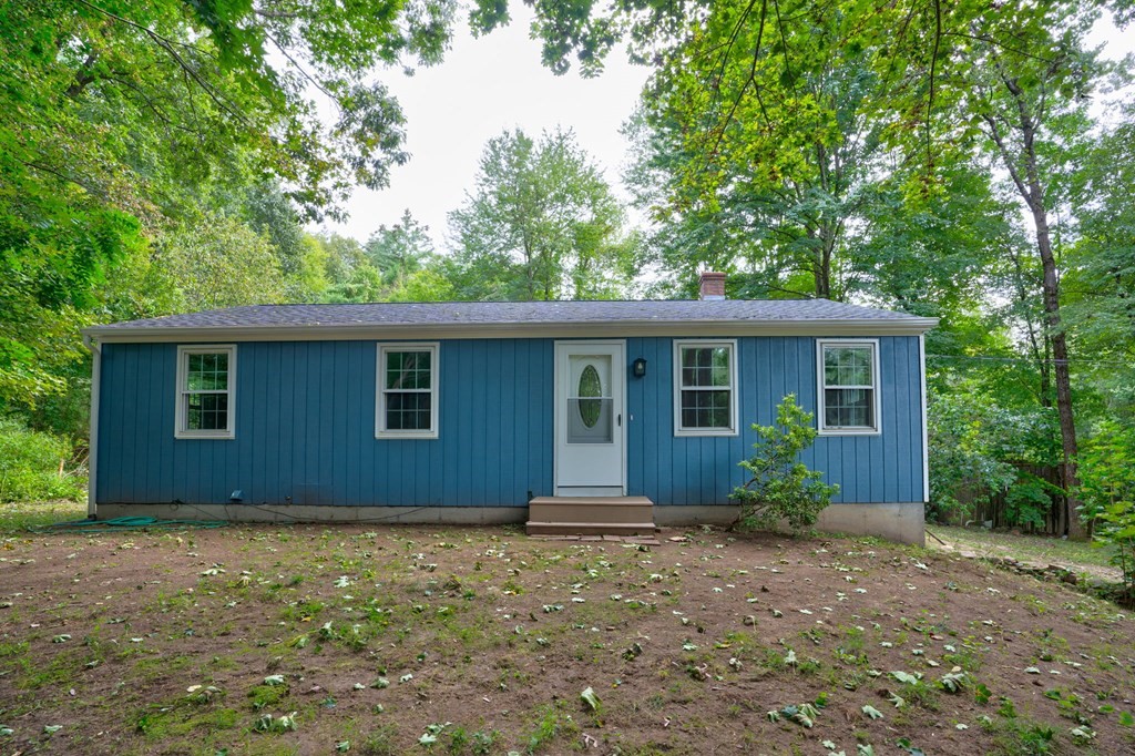 111 Bemis Road Warren, MA 01585 - Photo 1 of 25 a front view of house with yard and trees around