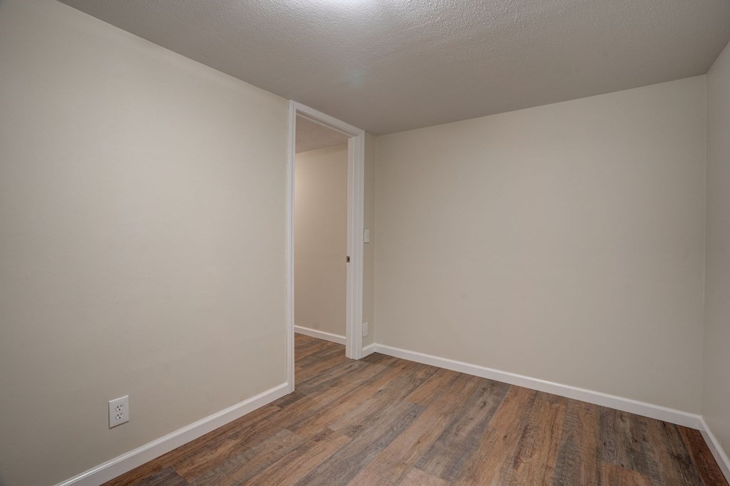 111 Bemis Road Warren, MA 01585 - Photo 23 of 25 an empty room with wooden floor