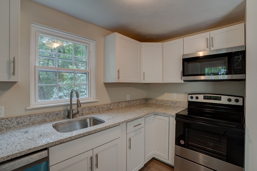 111 Bemis Road Warren, MA 01585 - Photo 8 of 25 a kitchen with appliances a sink and cabinets
