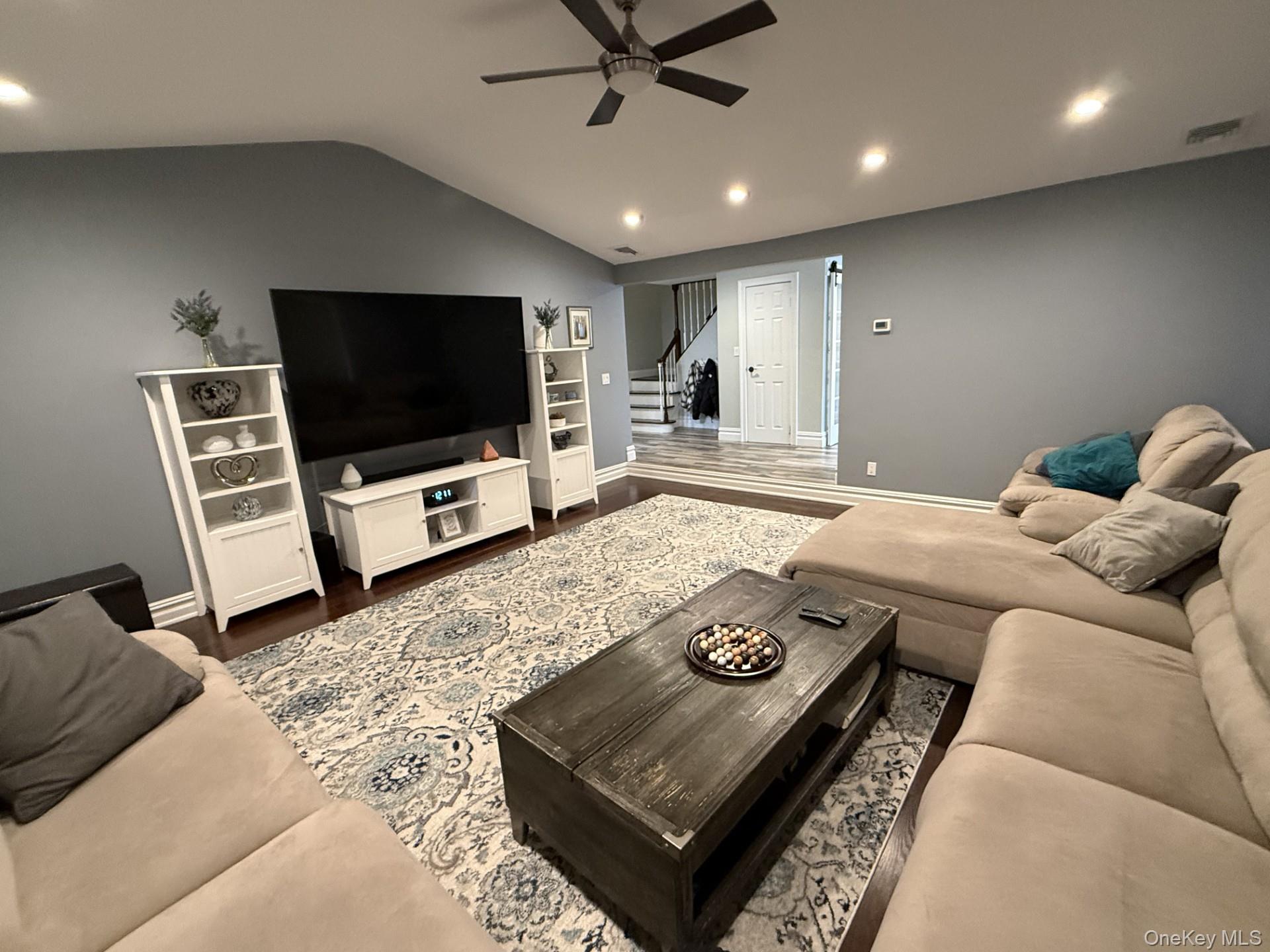 3 Pimlico Court Commack, NY 11725 - Photo 12 of 33 a living room with furniture and a flat screen tv