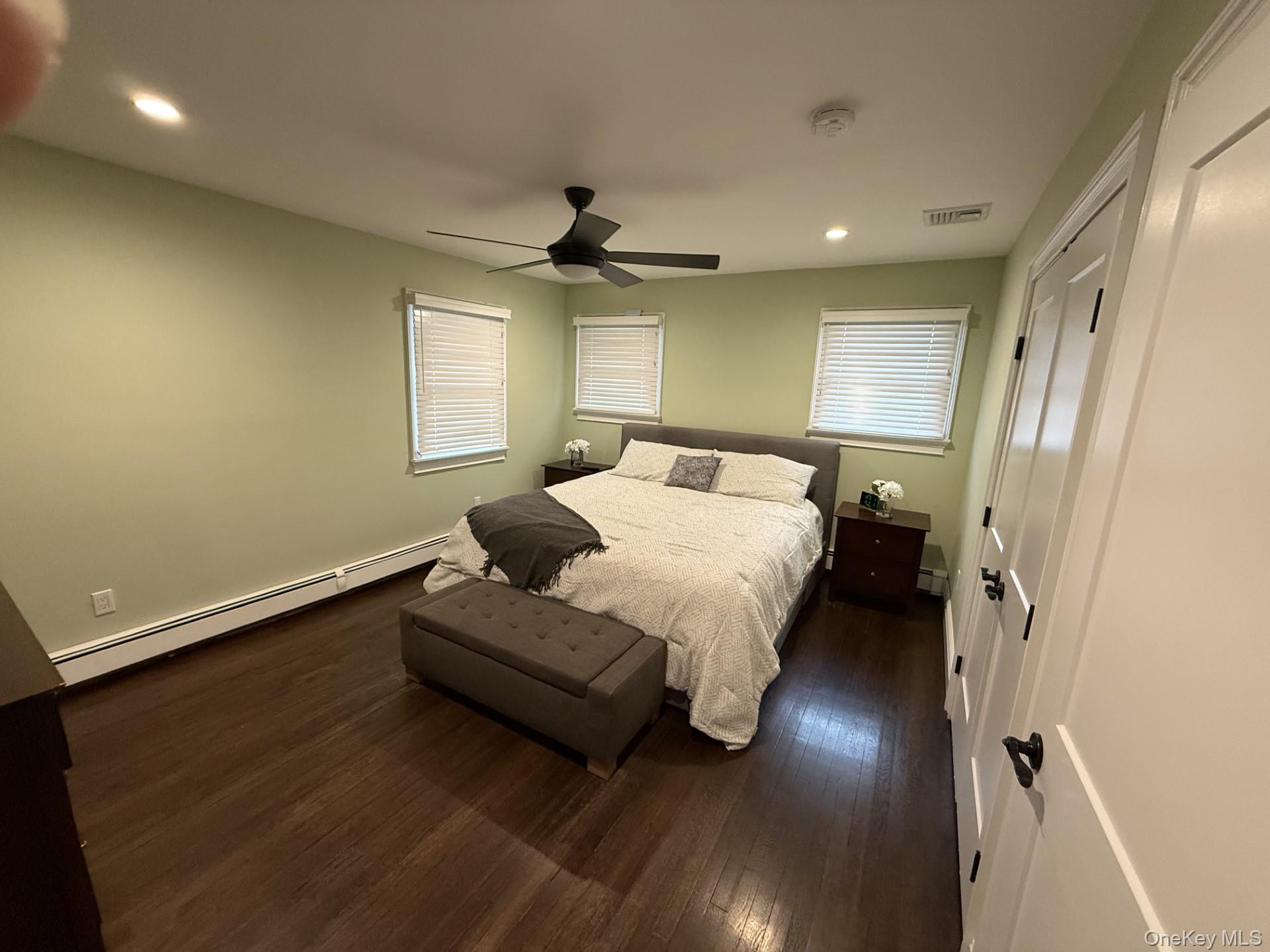3 Pimlico Court Commack, NY 11725 - Photo 14 of 33 a bedroom with a bed and wooden floor