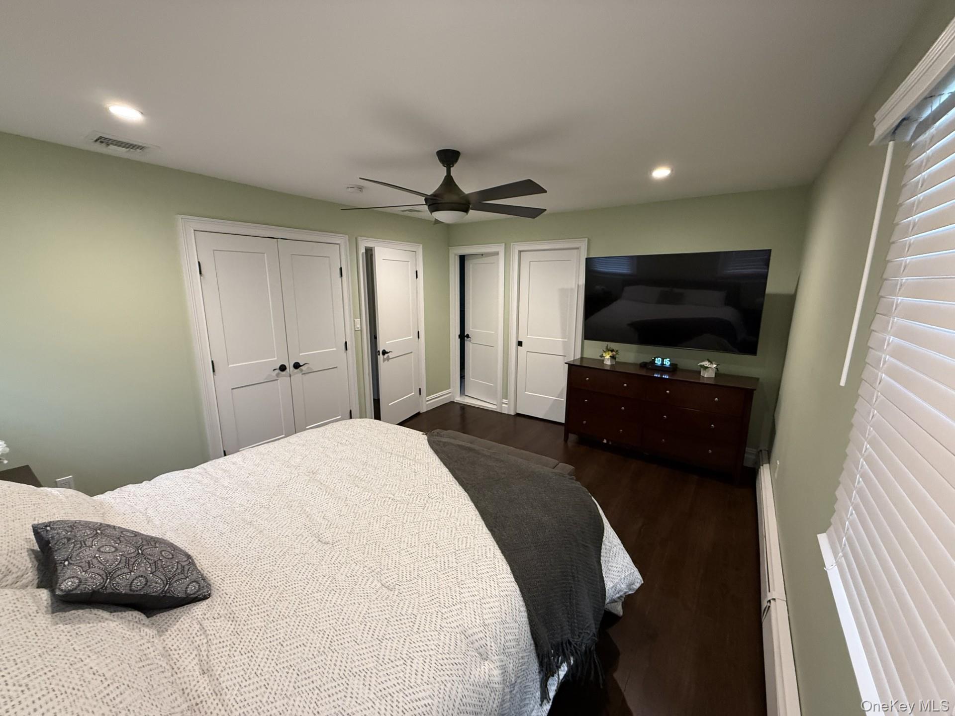 3 Pimlico Court Commack, NY 11725 - Photo 15 of 33 a bedroom with a bed and a flat screen tv