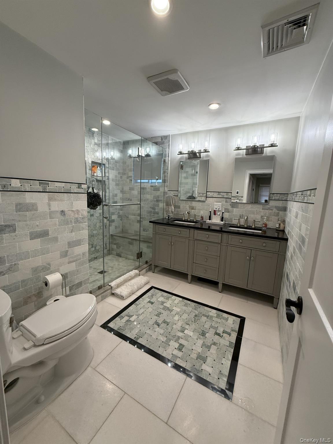 3 Pimlico Court Commack, NY 11725 - Photo 17 of 33 a bathroom with a granite countertop sink mirror vanity and toilet