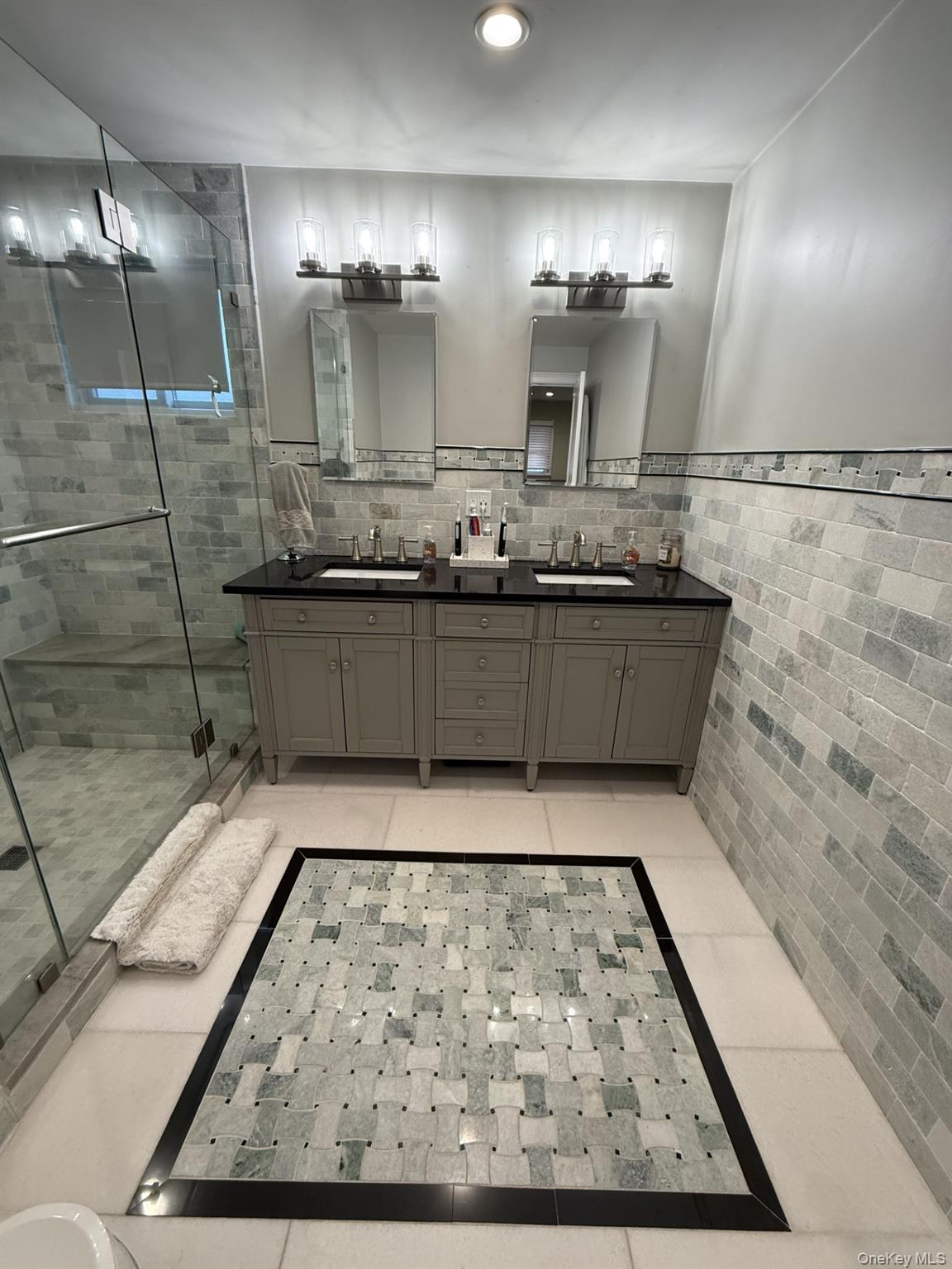3 Pimlico Court Commack, NY 11725 - Photo 18 of 33 a bathroom with a sink and mirror