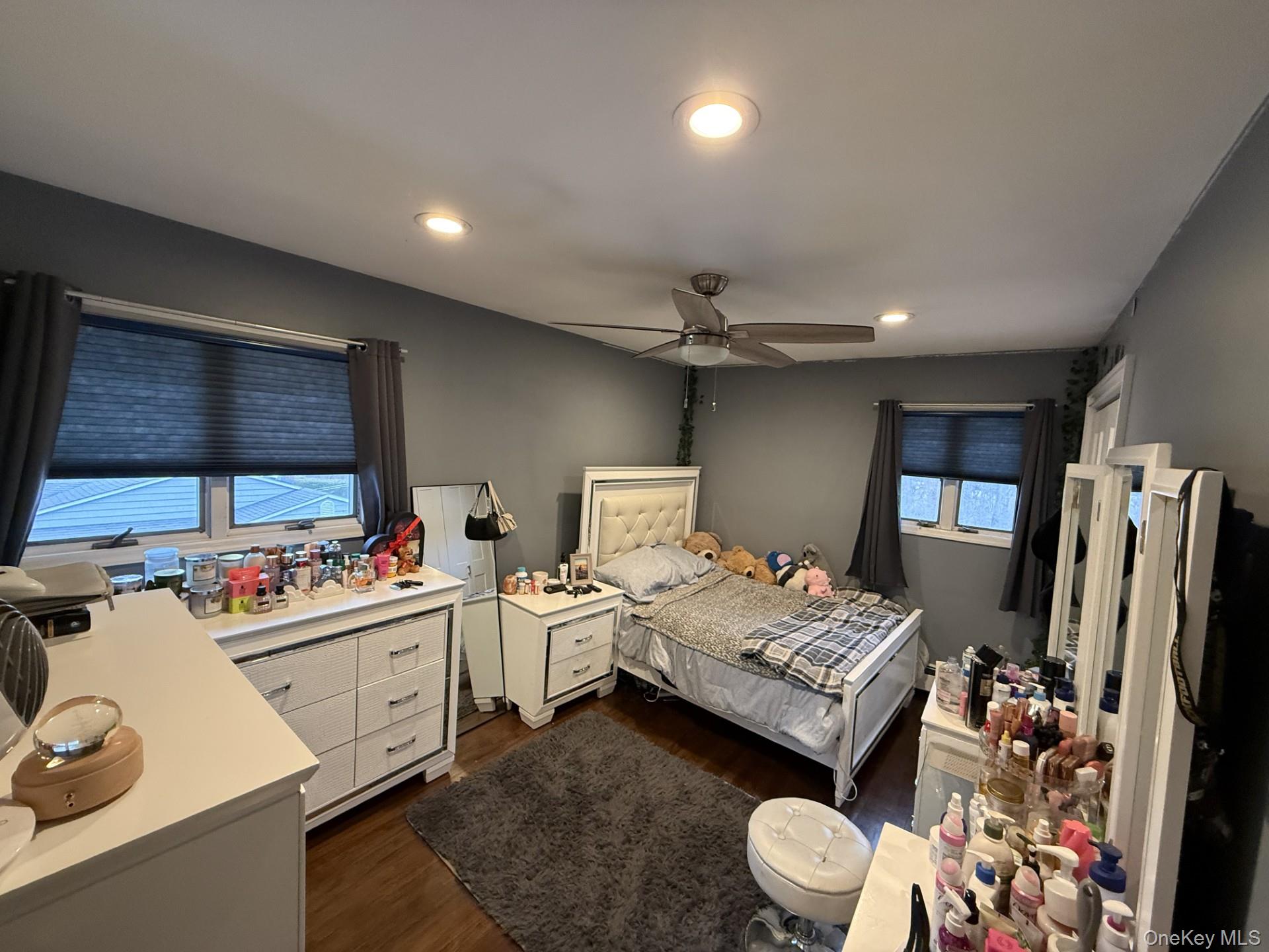 3 Pimlico Court Commack, NY 11725 - Photo 21 of 33 a bedroom with furniture and a flat screen tv