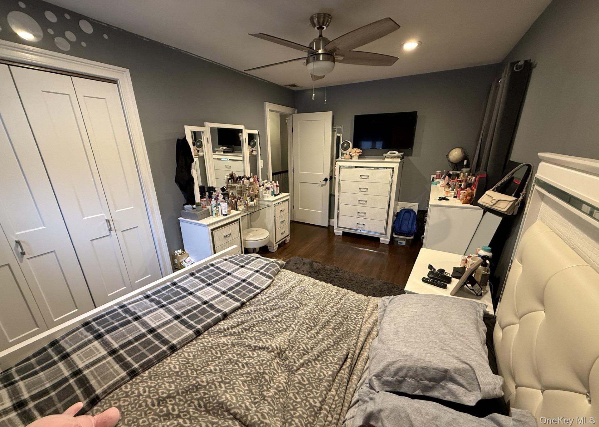 3 Pimlico Court Commack, NY 11725 - Photo 22 of 33 a bedroom with a bed and a flat screen tv