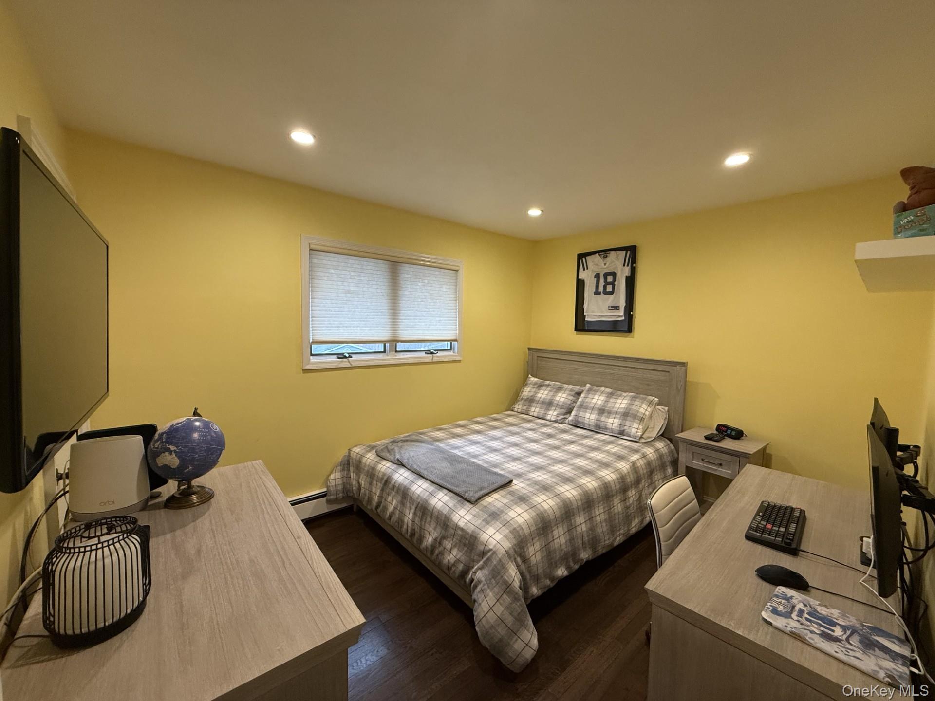 3 Pimlico Court Commack, NY 11725 - Photo 23 of 33 a bedroom with a bed and a couch