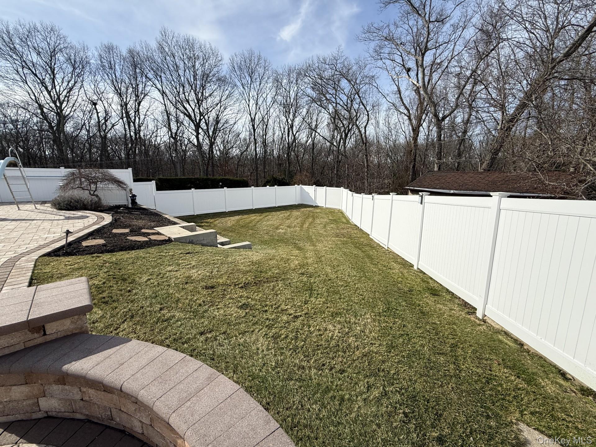 3 Pimlico Court Commack, NY 11725 - Photo 32 of 33 a view of a backyard with trees