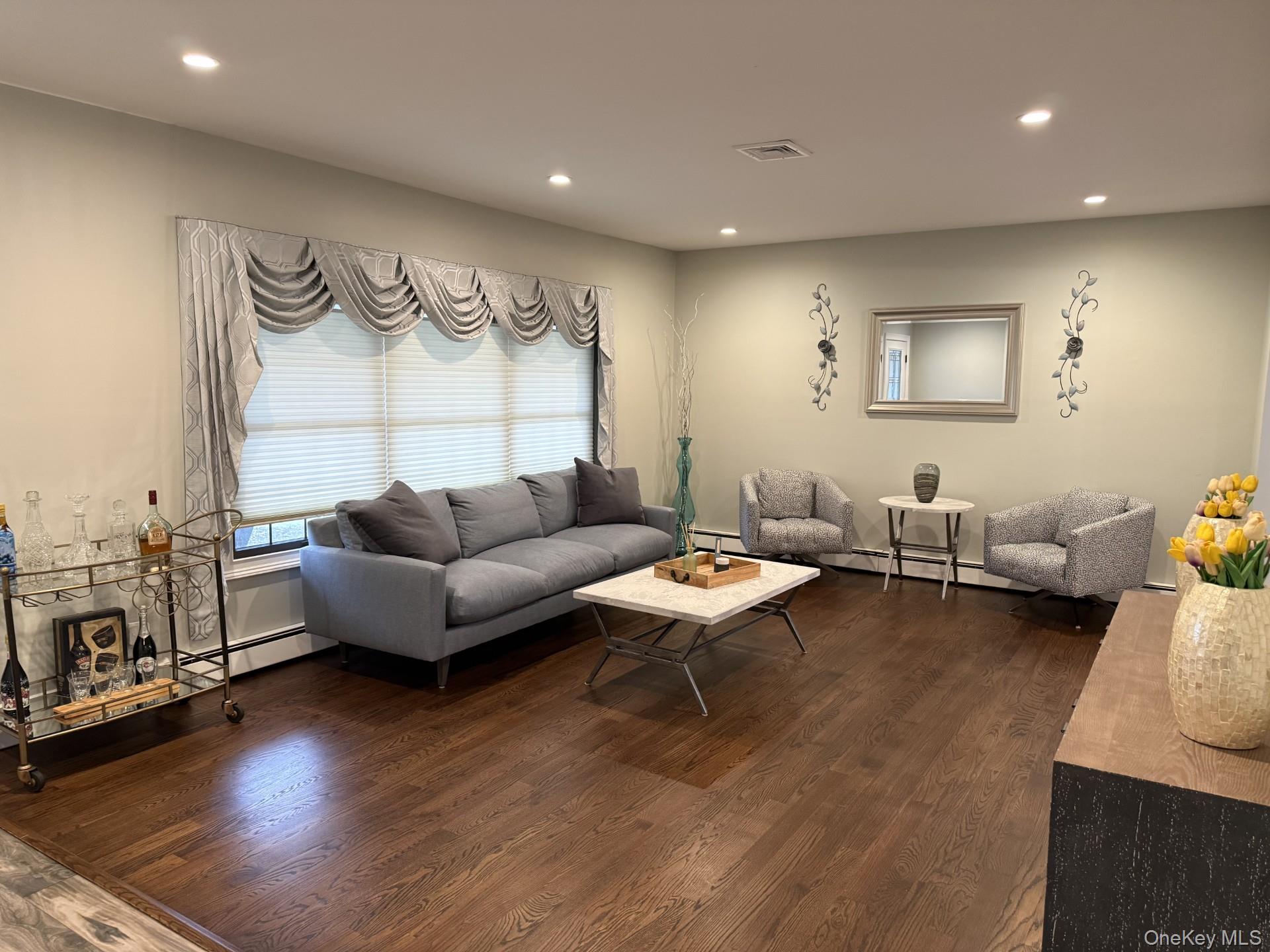 3 Pimlico Court Commack, NY 11725 - Photo 9 of 33 a living room with furniture and wooden floor