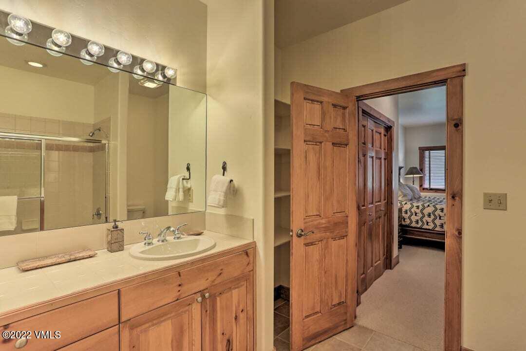 178 Knudson Ranch Road Edwards, CO 81632 - Photo 13 of 26 a bathroom with a double vanity sink mirror and shower