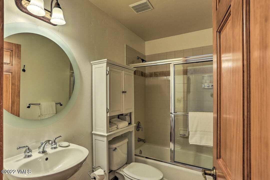 178 Knudson Ranch Road Edwards, CO 81632 - Photo 19 of 26 a bathroom with a sink toilet and shower