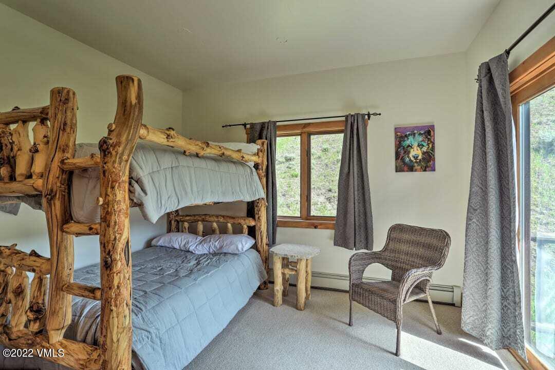 178 Knudson Ranch Road Edwards, CO 81632 - Photo 20 of 26 a bedroom with furniture and a window