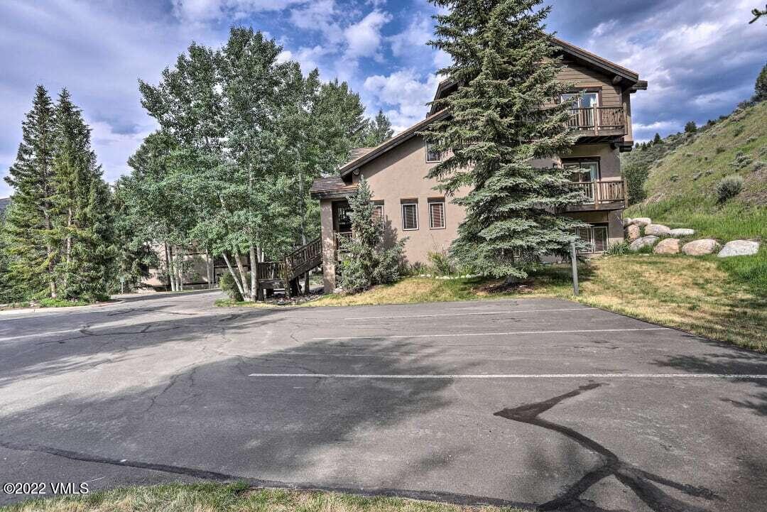 178 Knudson Ranch Road Edwards, CO 81632 - Photo 2 of 26 a view of a house with a yard