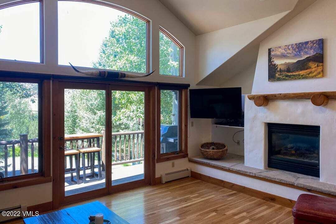 178 Knudson Ranch Road Edwards, CO 81632 - Photo 3 of 26 a living room with furniture fireplace and flat screen tv