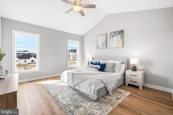 a bed room with a bed and a chandelier
