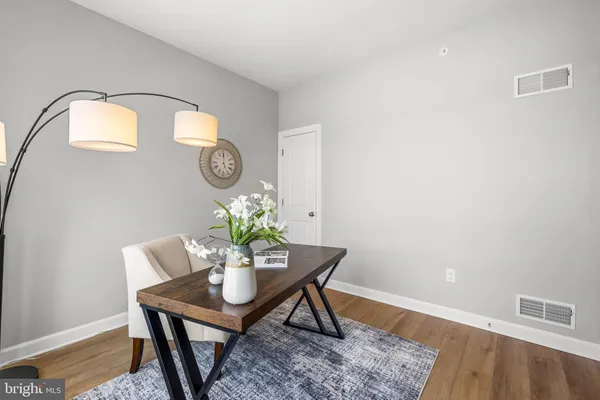 a workspace with furniture and wooden floor