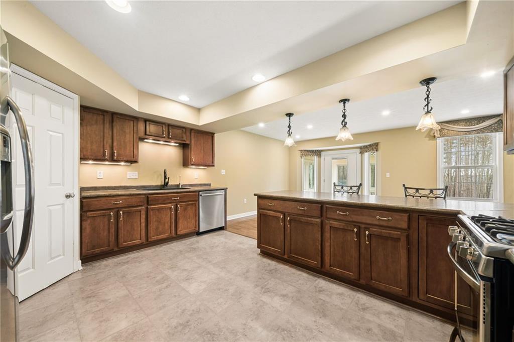317 Ann Circle Indiana, PA 15701 - Photo 11 of 39 a kitchen with stainless steel appliances granite countertop a sink stove and refrigerator