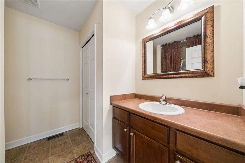 317 Ann Circle Indiana, PA 15701 - Photo 17 of 39 a bathroom with a sink a vanity and a mirror