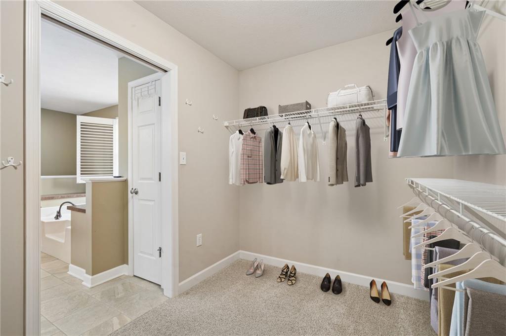 317 Ann Circle Indiana, PA 15701 - Photo 22 of 39 a view of walk in closet with clothes and shoes