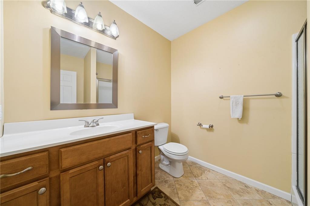317 Ann Circle Indiana, PA 15701 - Photo 27 of 39 a bathroom with a granite countertop sink toilet and mirror