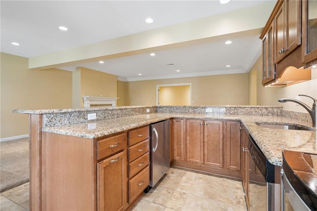 317 Ann Circle Indiana, PA 15701 - Photo 32 of 39 a kitchen with granite countertop a sink and cabinets
