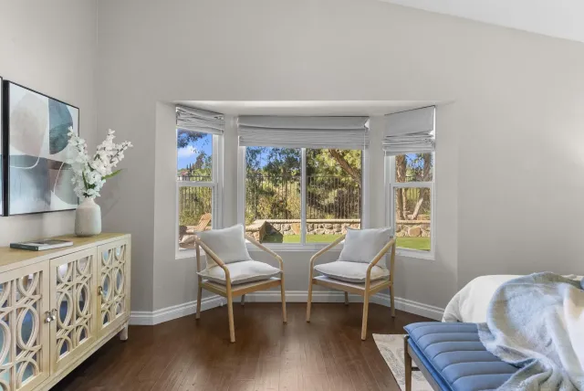 a dining room with furniture and wooden floor