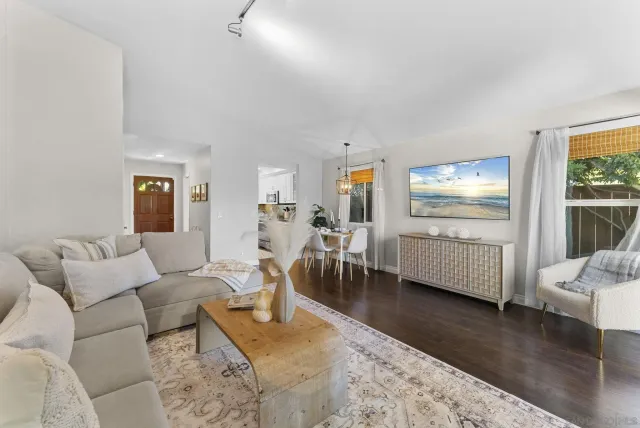 a living room with furniture and a table