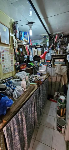 a living room with furniture fireplace and a window