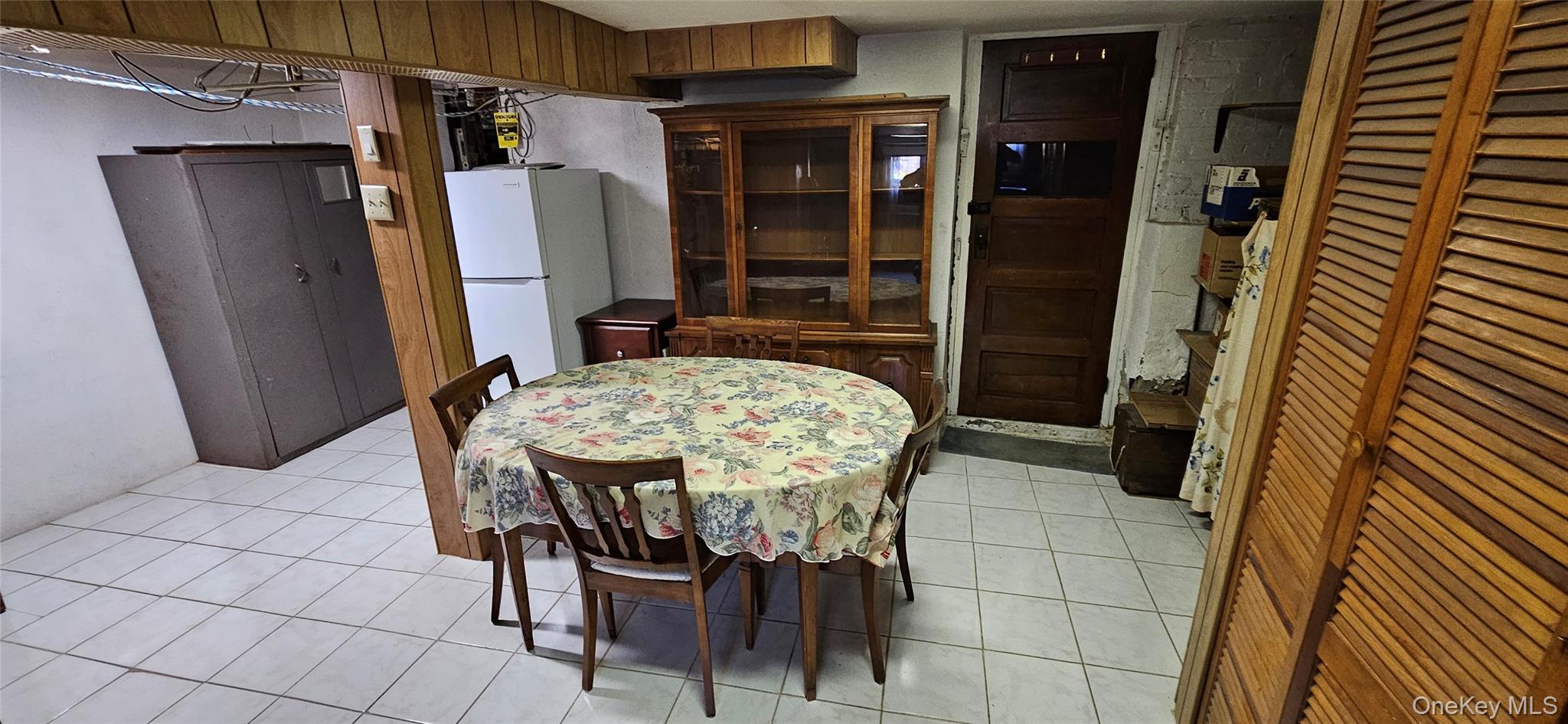 78-54 75th Street Queens, NY 11385 - Photo 14 of 31 Dining room with light tile patterned floors