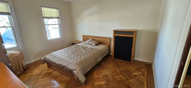 a bedroom with a bed and a bathroom